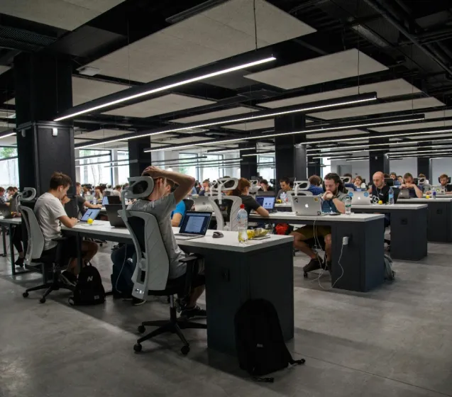 An office with office workers sitting at their desks